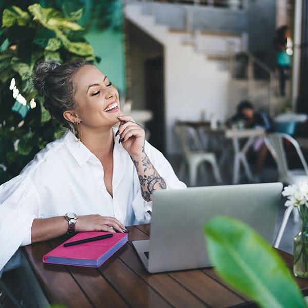 Remote worker at her laptop learning about SEO friendly websites