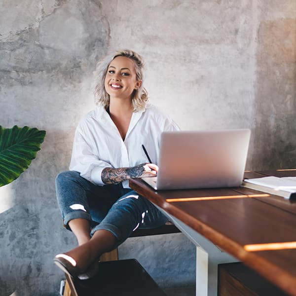 Woman on laptop learning about local SEO services