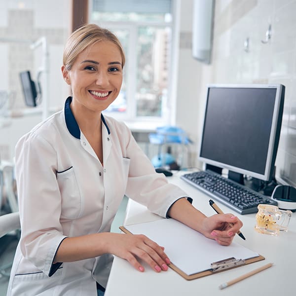 Dentist at computer learning about SEO for Dentists