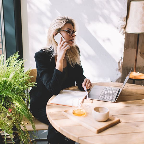 Woman on her phone talking about WordPress SEO services