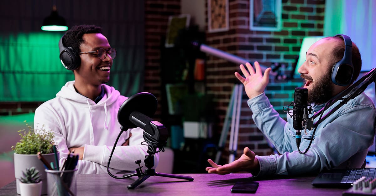Everything You Need to Know About a Podcast Manager 3 Two people on a podcast discussing their final thoughts on podcast managers